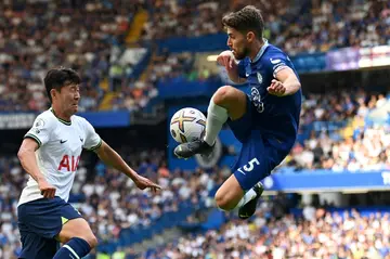 Tottenham forward Son Heung-min (left) in action against Chelsea