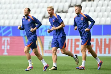 Netherlands' defender Daley Blind (L) warned his team-mates to expect fervent Turkish support on Saturday in Berlin