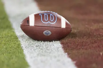 A ball on the field at Stanford Stadium during an American football game between the UCLA Bruins and the Stanford Cardinal on October 21, 2023, at Stanford Stadium in California.