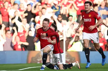 Manchester United's Scott McTominay (L) celebrates after scoring against Brentford