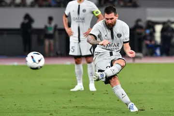 Lionel Messi takes a free kick during Paris Saint-Germain's  Japan Tour football match against Kawasaki Frontale in Tokyo