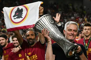 Jose Mourinho celebrates with the UEFA Europa Conference League trophy