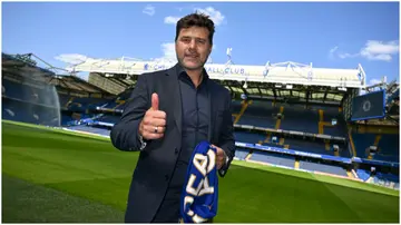 Chelsea boss Mauricio Pochettino poses for photos with a club scarf at Stamford Bridge. Photo by Darren Walsh.