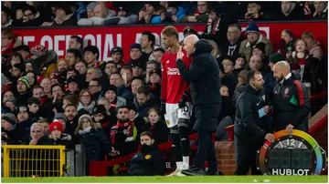 Erik ten Hag speaks to Marcus Rashford of Manchester United during the Premier League match between Manchester United and Chelsea FC at Old Trafford. Photo by Ash Donelon.