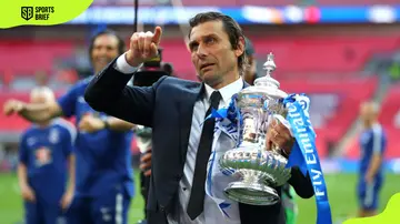 Chelsea manager Antonio Conte holds the Emirates FA Cup trophy