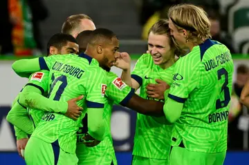 Wolfsburg forward Lukas Nmecha scored late to seal his team's win over Borussia Dortmund on Tuesday