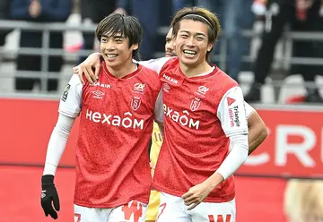 Junya Ito (L) celebrates with compatriot Keito Nakamura after scoring for Reims against Metz on Sunday