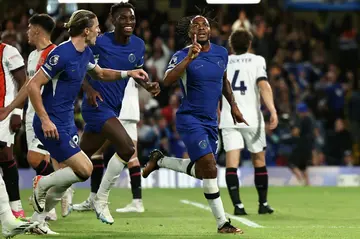 Chelsea's Raheem Sterling (R) celebrates scoring against Luton