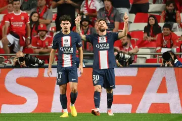 Lionel Messi (R) scored his 127th Champions League goal but PSG were frustrated by Benfica