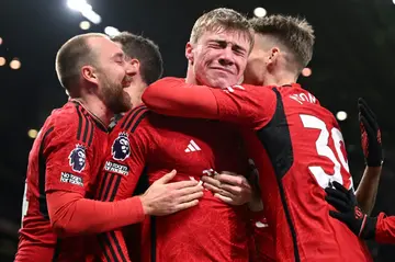 Manchester United's Rasmus Hojlund (C) celebrates after scoring against Aston Villa