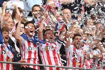 Sunderland players lifts the Sky Bet League One Play-Off trophy