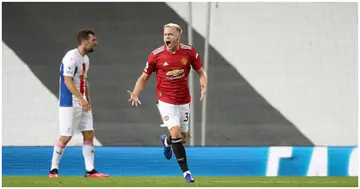 Donny Van De Beek celebrates after scoring his team's first goal during a Premier League match between Manchester United and Crystal Palace. Photo by Martin Rickett - Pool.