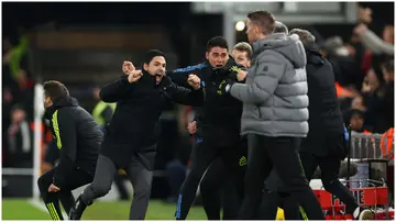 Arsenal coach, Mikel Arteta celebrates after Declan Rice scores the team's fourth goal against Luton Town on December 5, 2023 in Luton, England.