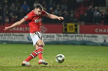 Spot-kick king - Charlton's Sam Lavelle scores the winning penalty in a shhot-out against Brighton