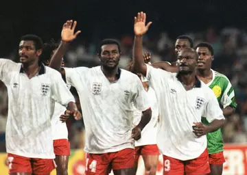 Cameroon players (from L) Francois Omam Biyick, Stephen Tataw and Roger Milla wave to their fans at the end of the 1990 World Cup quarter-final against England
