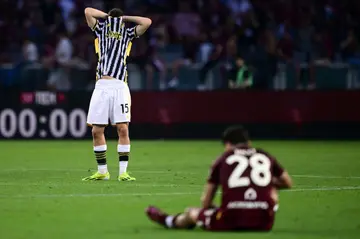 Juventus attacker Kenan Yidliz (L) shows his frustration as Samuele Ricci of Torino takes a seat