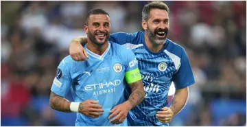 Kyle Walker and Scott Carson celebrate following Man City's victory in the UEFA Super Cup 2023 at Karaiskakis Stadium. Photo by Lexy Ilsley.