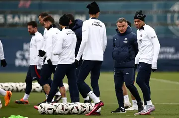 Kylian Mbappe (R) next to coach Christophe Galtier at a Paris Saint-Germain training session this week