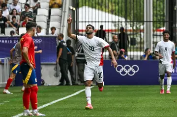 Ibrahim Adel celebrates after scoring one of his two goals for Egypt against Spain in Bordeaux