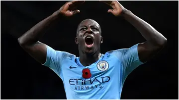 Benjamin Mendy celebrates victory after the Premier League match between Manchester City and Manchester United at Etihad Stadium. Photo by Laurence Griffiths.