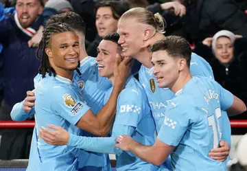Manchester City players celebrate after scoring their second goal during the Premier League match against Brentford FC