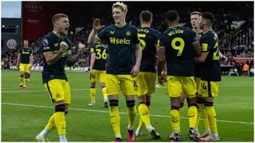 Newcastle United players celebrate during their Premier League match against Sheffield United at Bramall Lane. Photo by Andrew Kearns.