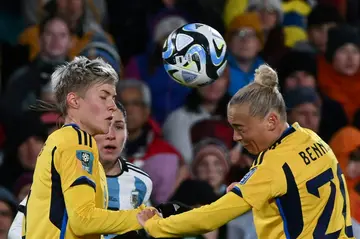 Sweden's midfielder Hanna Bennison (R) heads the ball