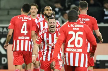 On target: Union Berlin defender Josip Juranovic (centre) celebrates his side's 1-0 win over Gladbach on Sunday