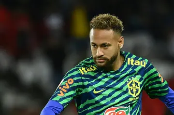 Brazil's forward Neymar warms up before a friendly football match between Brazil and Tunisia at the Parc des Princes in Paris on September 27, 2022
