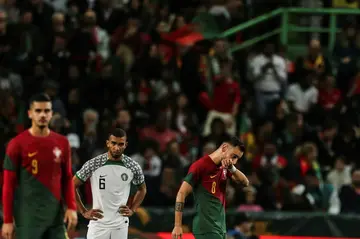 Portugal's midfielder Bruno Fernandes (R) celebrates after scoring a goal during the friendly football match between Portugal and Nigeria