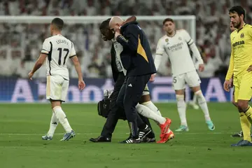 Real Madrid's Austrian defender David Alaba is helped to leave the pitch after suffering a cruciate ligament injury against Villarreal