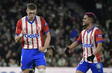 Artem Dovbyk (L) scored his fourth goal in three games to keep up Girona's unexpected title challenge