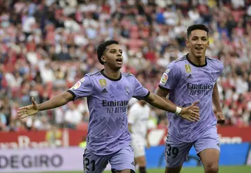 Real Madrid's Brazilian forward Rodrygo (L) celebrates after scoring against Europa League finalists Sevilla