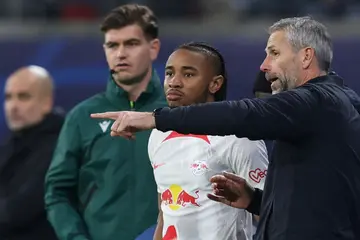 Leipzig head coach Marco Rose talks to French forward Christopher Nkunku. The forward has 12 goals in the league for Leipzig this season, the second-highest in the Bundesliga