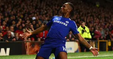 Didier Drogba celebrates scoring the first goal during the Barclays Premier League match between Manchester United and Chelsea at Old Trafford in 2014. Photo by Laurence Griffiths.