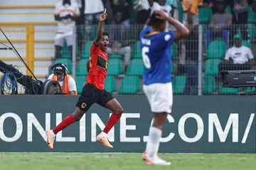 Gelson Dala (L) celebrates his second goal for Angola against Namibia