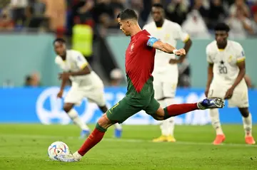 Cristiano Ronaldo takes the penalty which made him the first man in history to score in five World Cups