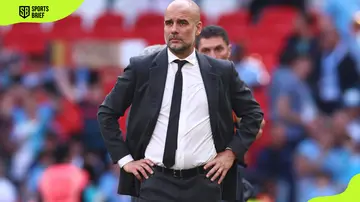 Pep Guardiola looks on after losing the FA Cup Final