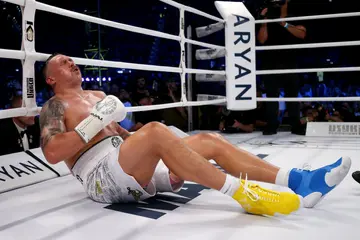 Oleksandr Usyk on the canvas.