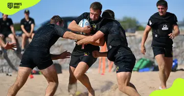 Exeter Chiefs players during a beach rugby training session
