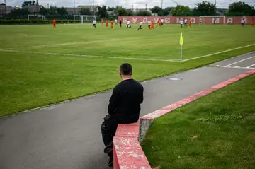 FSC Mariupol president Oleksandr Yaroshenko watches his team in action during a friendly