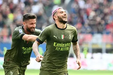 Long range special: Olivier Giroud (left) congratulates fellow French international  Theo Hernandez on his goal for AC Milan against Lazio