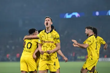 Schlotterbeck (2L) celebrates with Dortmund after beating Paris Saint-Germain in the Champions League semi-final, second leg in Paris