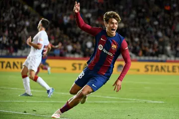 Barcelona forward Marc Guiu celebrates after scoring his first goal on his debut against Athletic Bilbao on Saturday