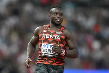 Kenya's Ferdinand Omanyala crosses the finish line in the men's 100m heats during the World Athletics Championships at the National Athletics Centre
