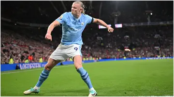 Erling Haaland celebrates during the Premier League match between Manchester United and Manchester City at Old Trafford. Photo by Michael Regan.