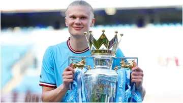 Erling Haaland poses for a photo with the Premier League trophy after the Premier League match between Manchester City and Chelsea. Photo by Matt McNulty.