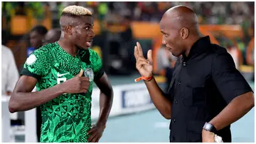 Nigeria's Victor Osimhen of talks with Didier Drogba after AFCON 2023 Round of 16 match victory against Cameroon at Stade Felix Houphouet-Boigny on January 27. Photo: MB Media.