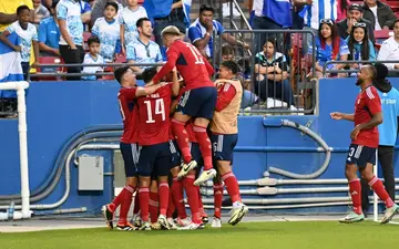 Costa Rica's players celebrate during their playoff win over Honduras to reach the Copa America