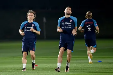 Croatia midfielders Luka Modric (L) and Mateo Kovacic take part in a training session in Doha